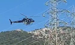 Yüksek gerilim hatlarındaki helikopter yürekleri ağza getirdi