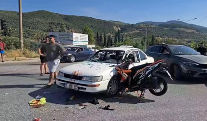 Söke’de motosiklet otomobile saplandı