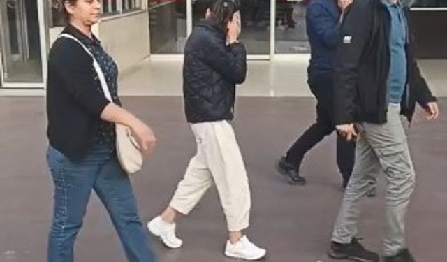 Aydın’da yakalanan 24 yaşındaki kadın kameraları görünce yüzünü gizlemeye çalıştı